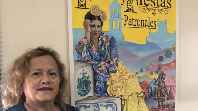 Carmen Roldán, junto al cartel de la Feria de Los Barrios de 2019